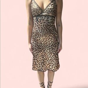 London Girl black and brown leopard print slip dress with black ribbon and bow.